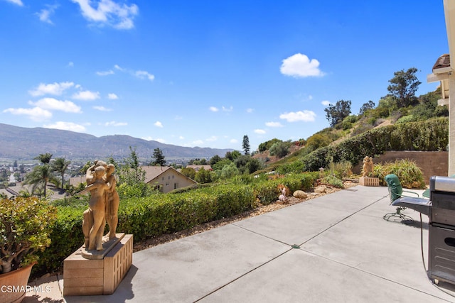 view of patio / terrace featuring a mountain view