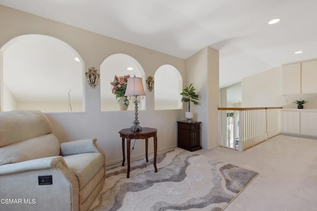 sitting room with light colored carpet