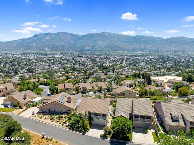 birds eye view of property featuring a mountain view