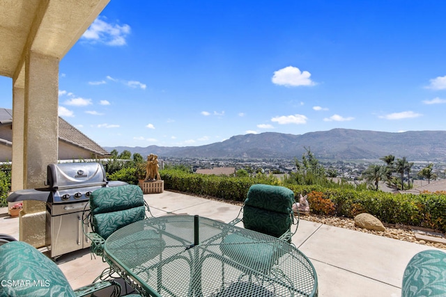 view of patio / terrace with a mountain view