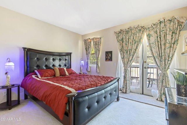 carpeted bedroom featuring french doors and access to outside