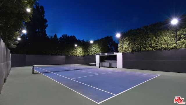 view of sport court with basketball hoop