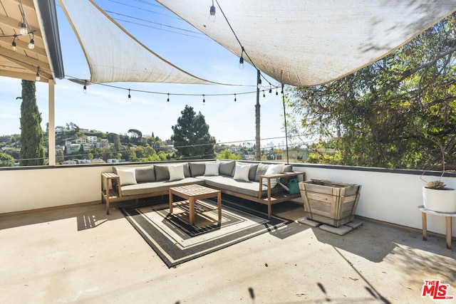 view of patio with an outdoor hangout area and a balcony