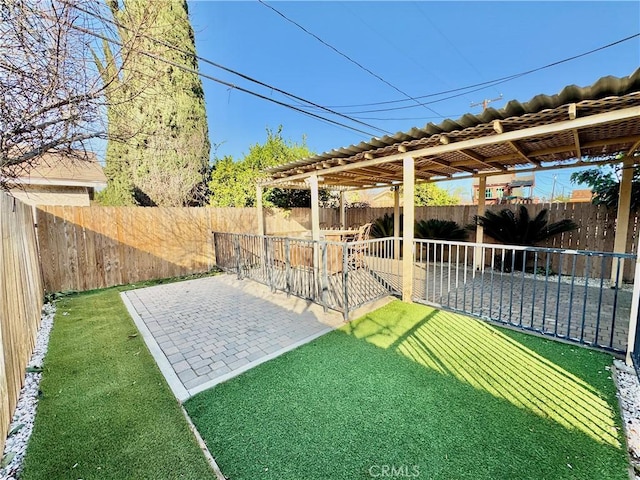 view of yard featuring exterior bar and a patio