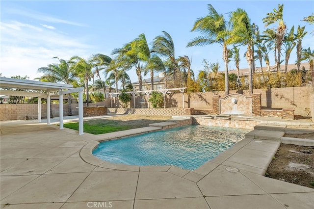 view of pool with pool water feature and a patio