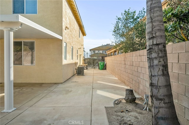 view of home's exterior featuring central air condition unit and a patio area