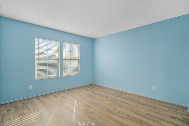 empty room featuring light hardwood / wood-style floors