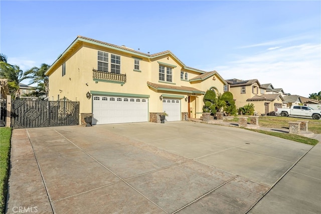 mediterranean / spanish-style home with a garage