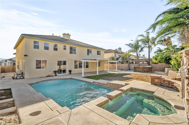 view of pool with an in ground hot tub and a patio