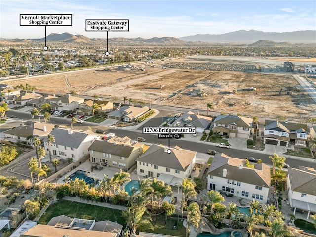 birds eye view of property featuring a mountain view