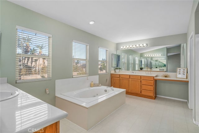 bathroom featuring a tub to relax in and vanity