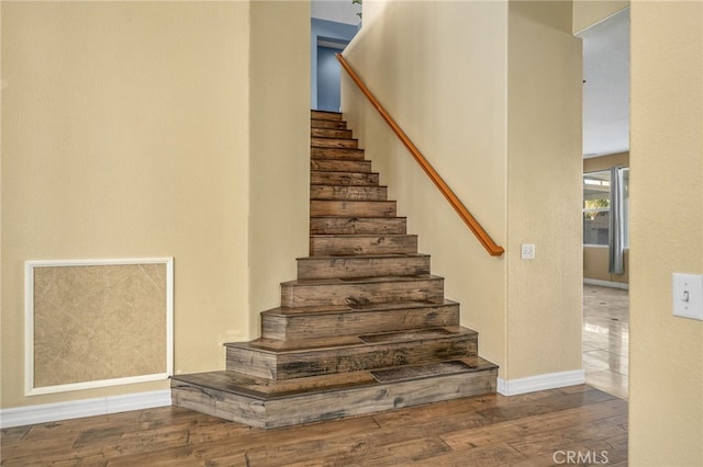 stairway featuring hardwood / wood-style floors