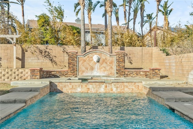 view of pool featuring pool water feature