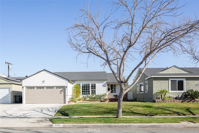 single story home featuring a garage and a front yard