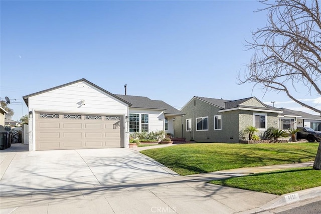 ranch-style house featuring a front yard and a garage