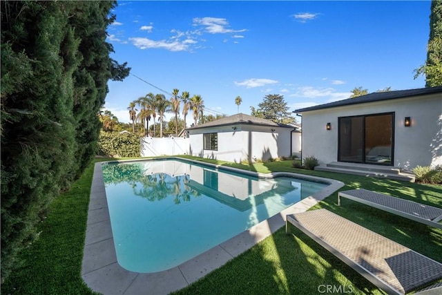 view of pool featuring a yard