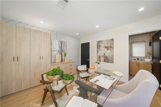 living room with light hardwood / wood-style flooring