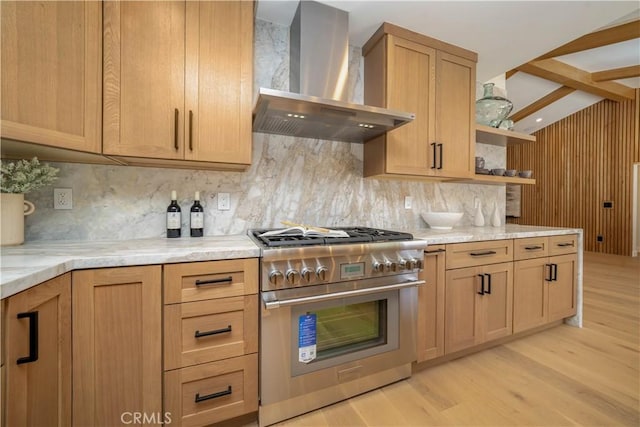 kitchen with light wood-type flooring, wall chimney exhaust hood, backsplash, and high end stainless steel range