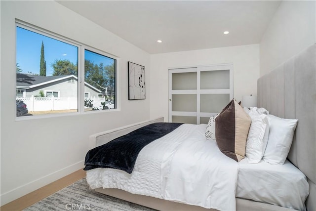 bedroom with hardwood / wood-style flooring