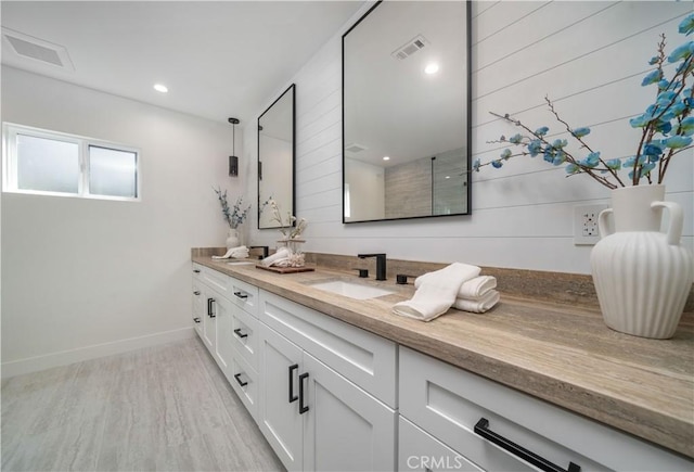 bathroom featuring hardwood / wood-style floors and vanity