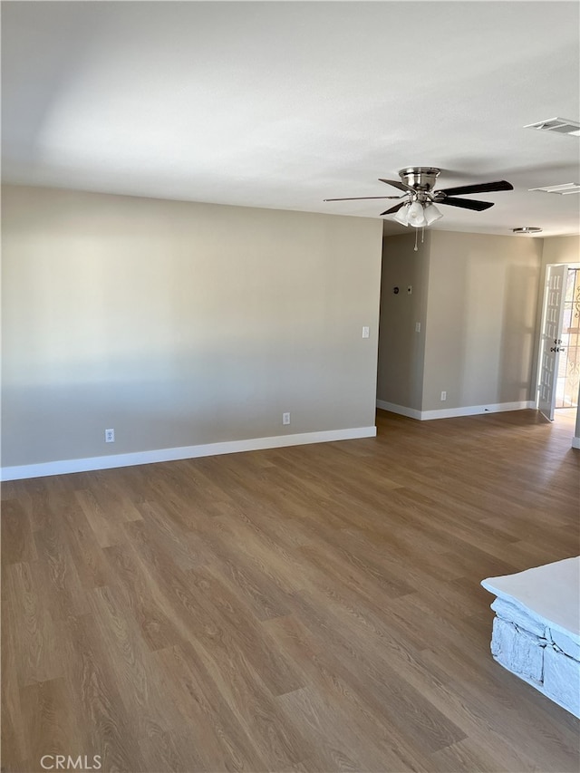 unfurnished room featuring hardwood / wood-style flooring and ceiling fan