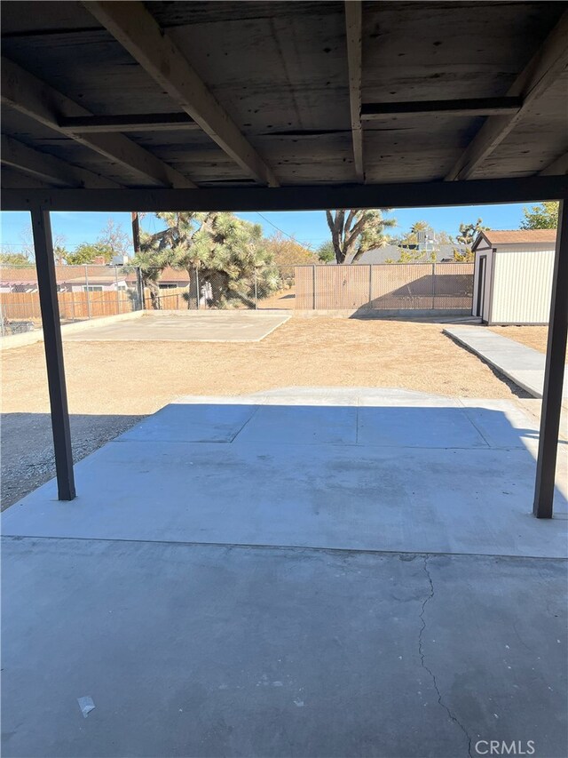 view of patio / terrace featuring a storage shed