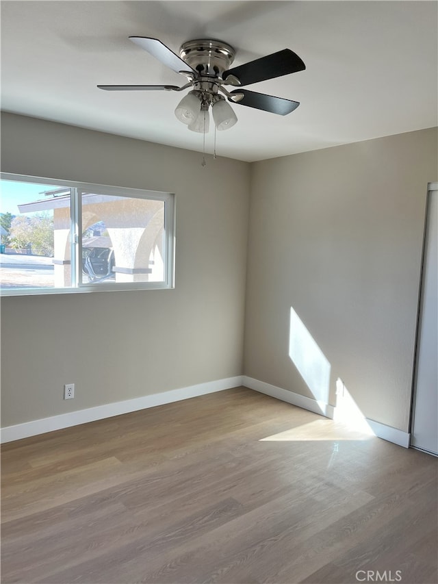 unfurnished room featuring light hardwood / wood-style floors