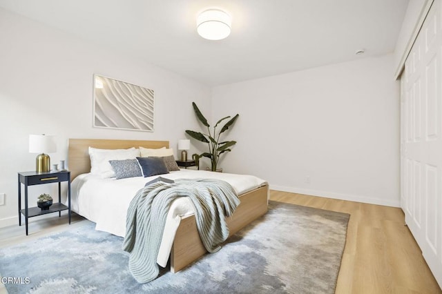 bedroom with hardwood / wood-style floors