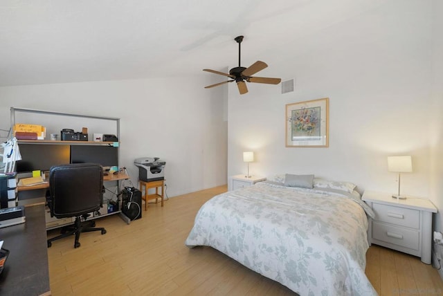 bedroom with light wood-type flooring, ceiling fan, and lofted ceiling