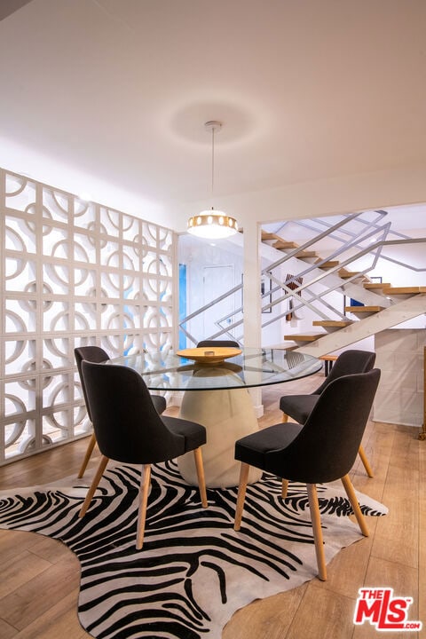 dining area featuring light wood-type flooring