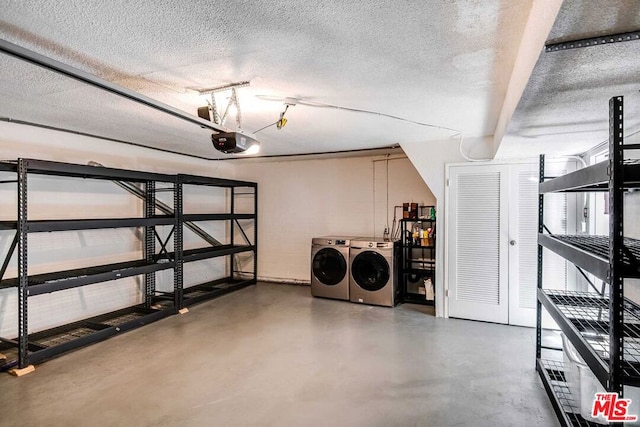 basement featuring a textured ceiling and washer and clothes dryer