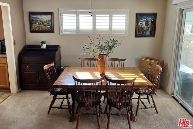 view of carpeted dining area