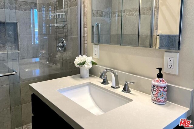 bathroom featuring vanity and walk in shower