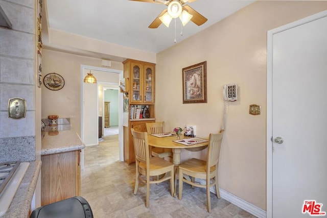 dining space with ceiling fan