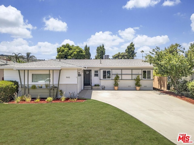 ranch-style home with a front lawn