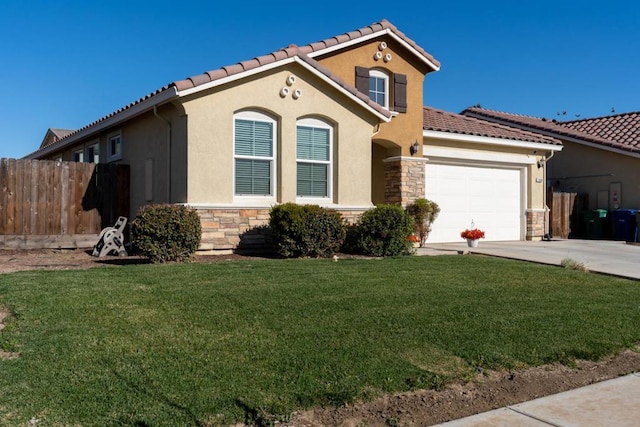 mediterranean / spanish house with a garage and a front lawn