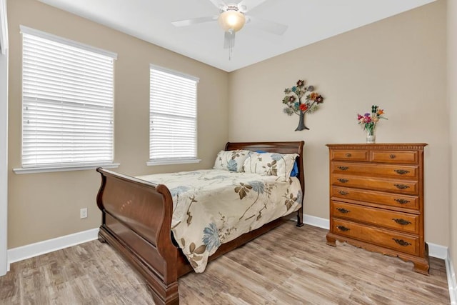 bedroom with light wood-type flooring and ceiling fan