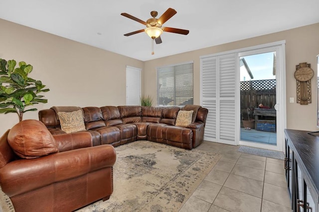 tiled living room featuring ceiling fan