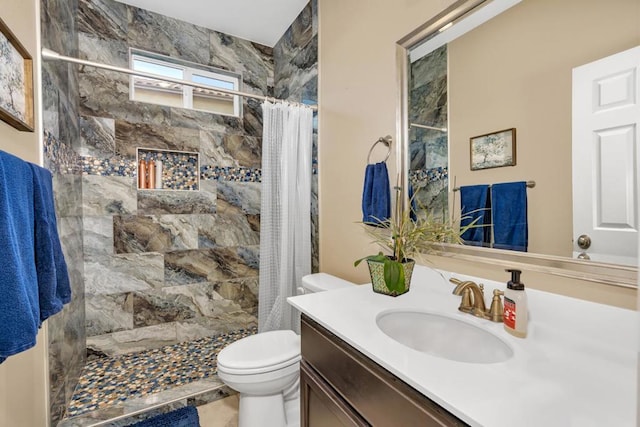 bathroom featuring curtained shower, toilet, and vanity