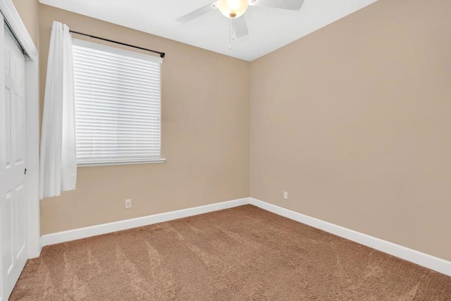 unfurnished room with carpet floors and ceiling fan