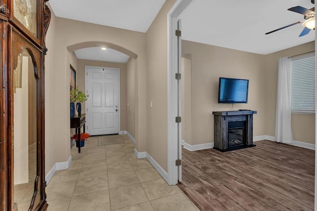 hall with light tile patterned floors