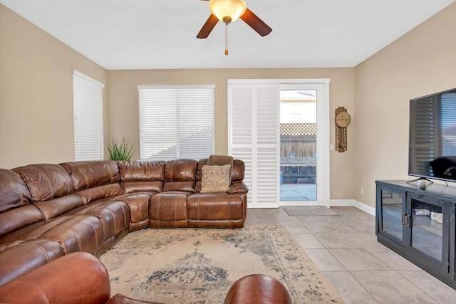 tiled living room featuring ceiling fan