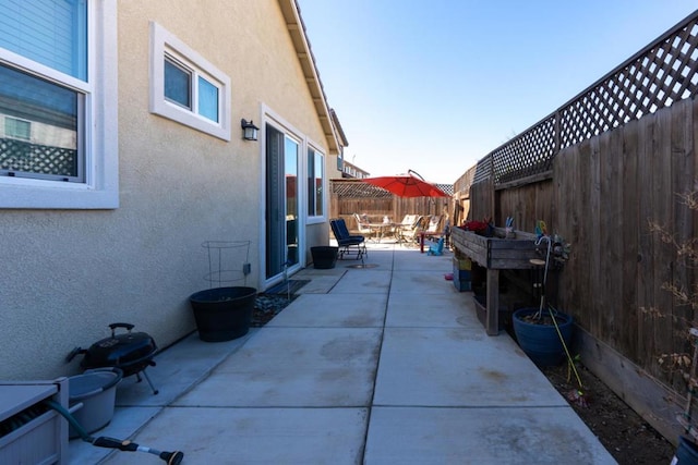 view of property exterior featuring a patio area