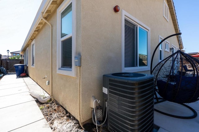 view of side of home featuring central AC unit