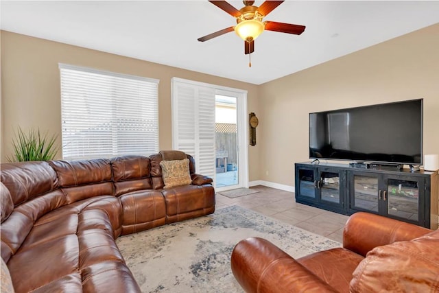 tiled living room with ceiling fan