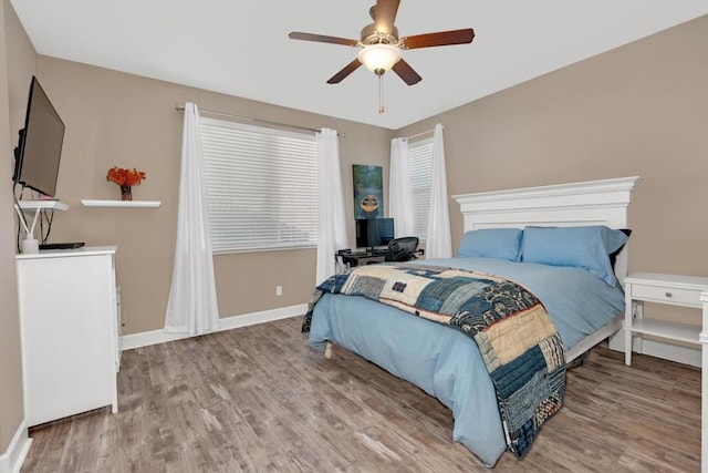 bedroom featuring ceiling fan and light hardwood / wood-style flooring