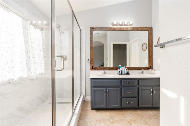 bathroom with vanity, tile patterned floors, and walk in shower