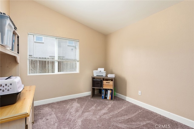 office featuring lofted ceiling and carpet