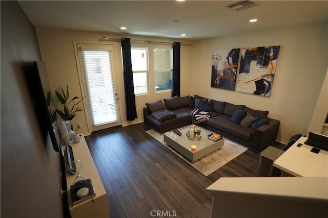 living room with dark hardwood / wood-style floors