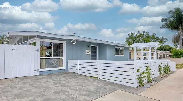 view of home's exterior featuring a pergola